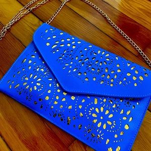 Cross Body. Bright Blue. Never used. Make an offer